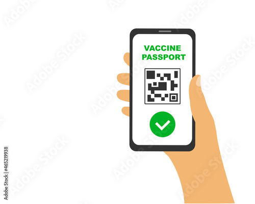 Smartphone with qr code on vaccination passport screen in hand