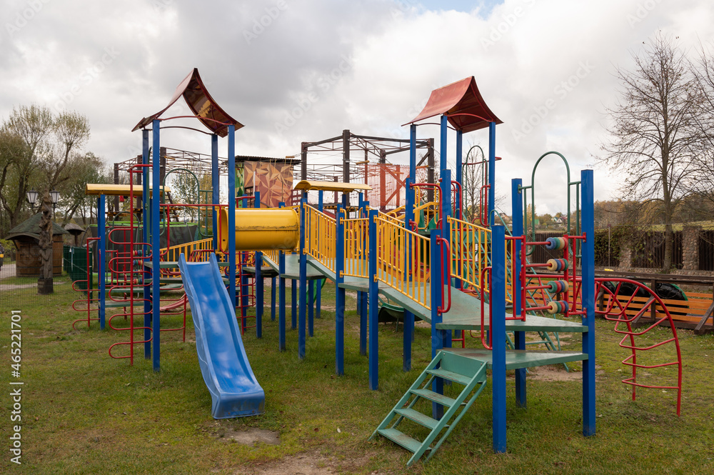Children's playground with swings, agility equipment, slide and challenge net Children's playground with swings, agility equipment, slide and challenge net