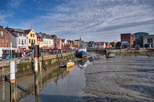 Husum harbor at ebb tide in the marshes, Germany