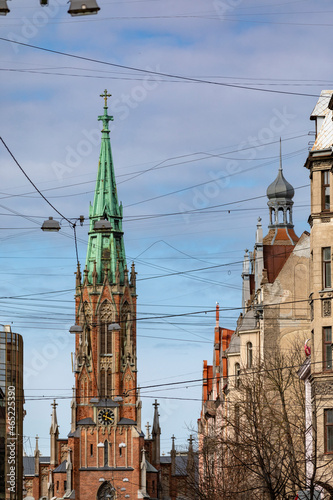 A view of a lutheran church in Riga which is obstructed with cables and wires symbolizing the outside world interfering with our spirituality
