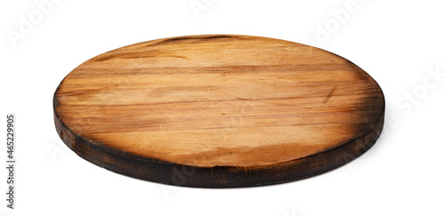 Dark wooden cutting board on white background photo
