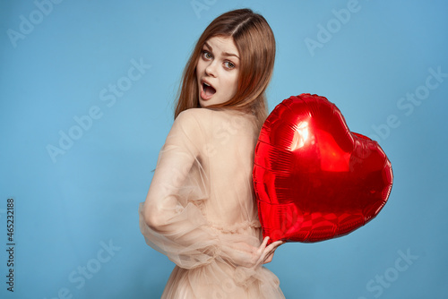 beautiful woman red heart in the hands of the balloon isolated background