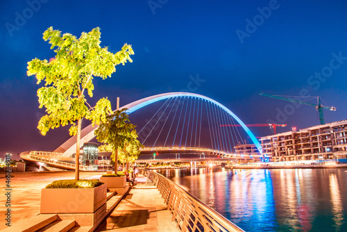 Obraz na płótnie Beautiful incredible cityscape with Tolerance bridge near the water canal in Dubai, United Arab Emirates. w salonie