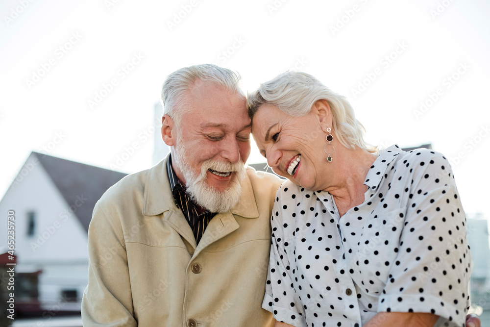Cheerful couple at building terrace Cheerful couple at building terrace