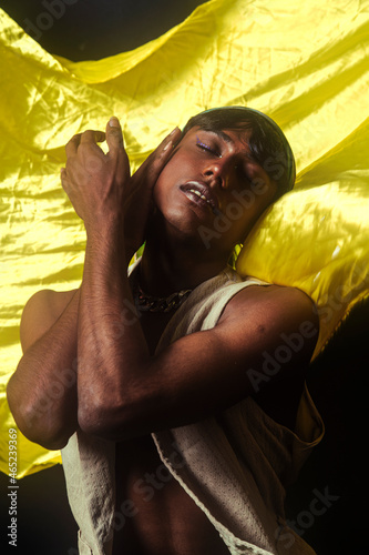 Photography Two Malaysian Indian men in a studio setting with cloth flying in the background