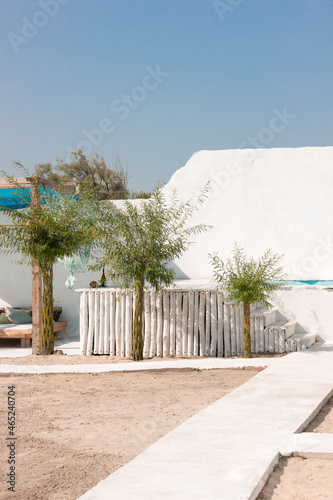 greek view near swimming pool with nobody. white villa in greece. travel concept, free space © NASTYA PALEHINA