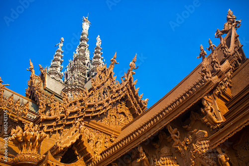 Wooden Temple in Pattaya. Traveling in Thailand. Wooden sculptures of beautiful carved patterns on the roof. © Vera