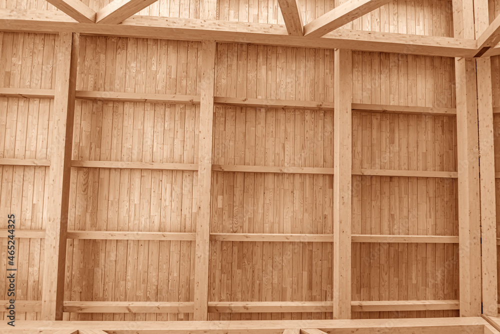 Wooden roof construction. Part of the floor of a wooden house.