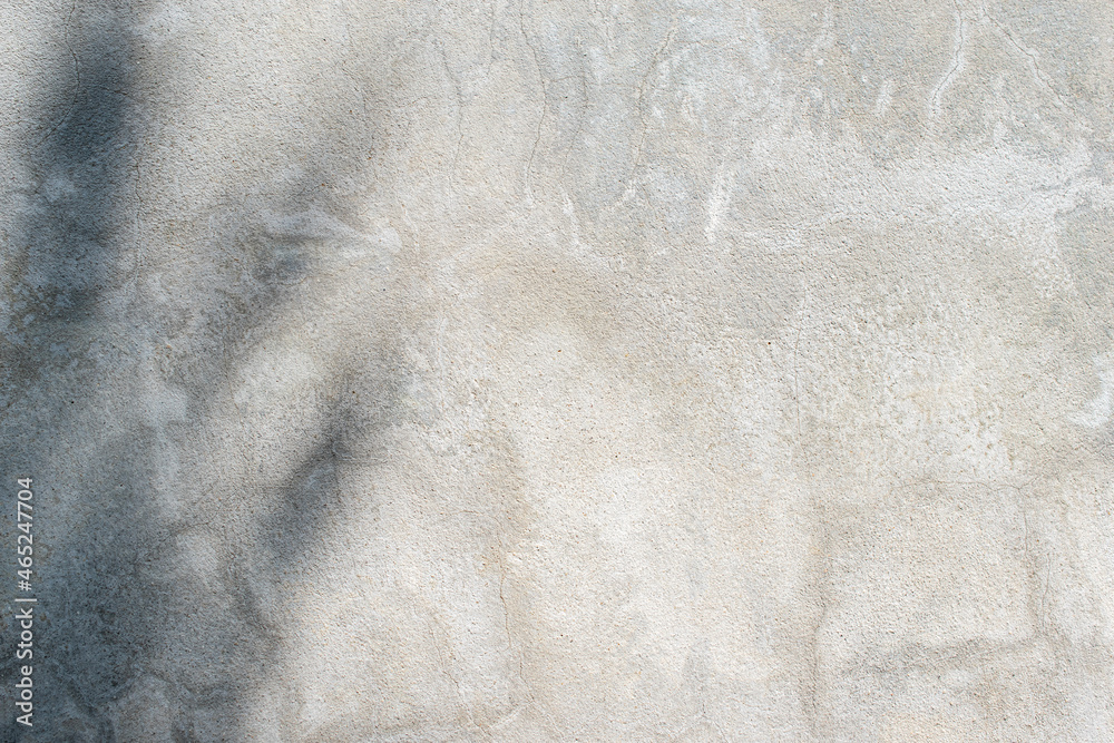 Obraz premium Gray cement wall texture with beautiful abstract sunlight shadows.
