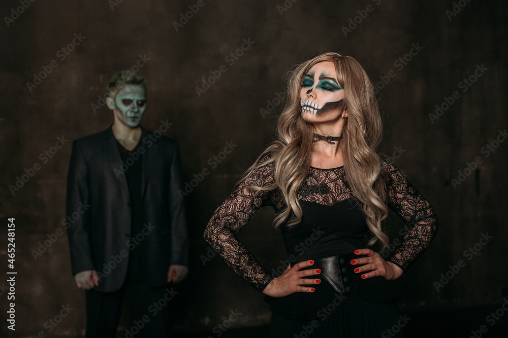 The image of a skeleton girl and the image of a Frankenstein man on Halloween in the dark. an image for a couple on Halloween. women are ahead of men The image of a skeleton girl and the image of a Frankenstein man on Halloween in the dark. an image for a couple on Halloween. women are ahead of men