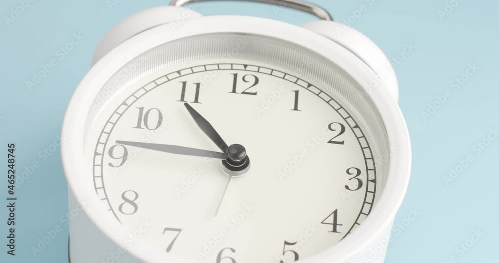 alarm clock isolated on a blue background, Showtime 10.40 am or pm, Timelapse moving fast. alarm clock isolated on a blue background, Showtime 10.40 am or pm, Timelapse moving fast.