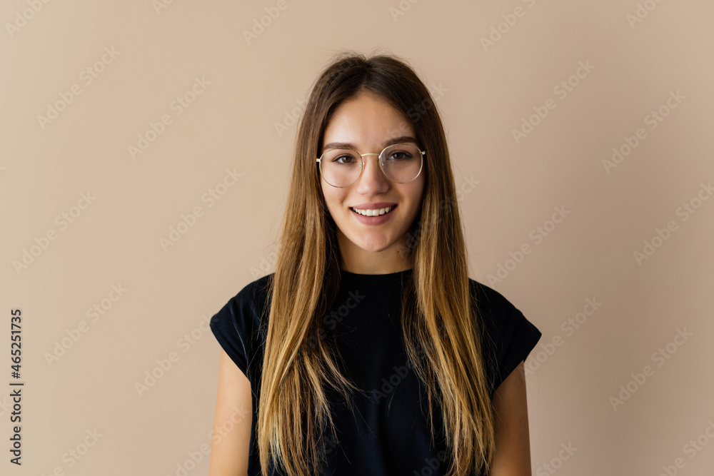 Portrait of cheerful brunette woman isolated on beige background Portrait of cheerful brunette woman isolated on beige background