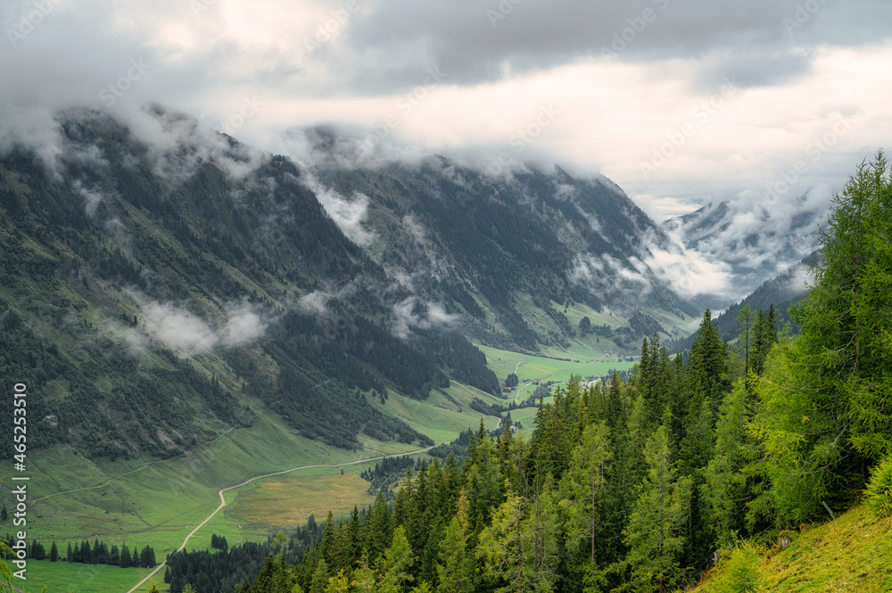 Low clouds over green valley in High Tauern National Park Low clouds over green valley in High Tauern National Park