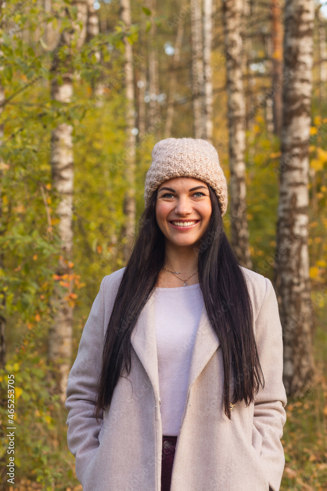 Portrait of a joyful young woman enjoying in the autumn park. Portrait of a joyful young woman enjoying in the autumn park.