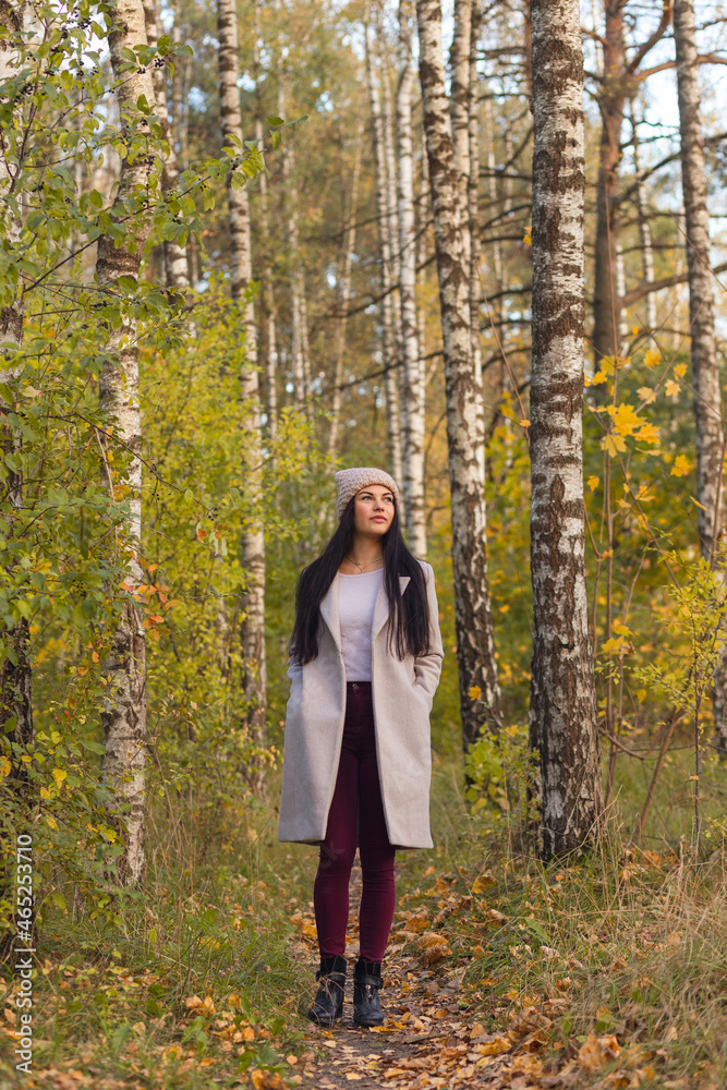 Portrait of a joyful young woman enjoying in the autumn park. Portrait of a joyful young woman enjoying in the autumn park.