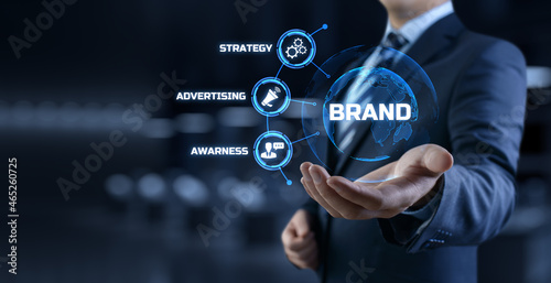 Brand development marketing strategy concept. Businessman pressing button on screen.
