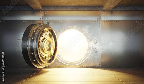 Open Bank vault door with gold light comes out from inside photo