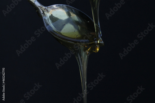 HONEY FLOWING FROM A SPOON