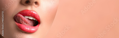 Woman lips on beige studio background, panorama. Makeup concept, design photo