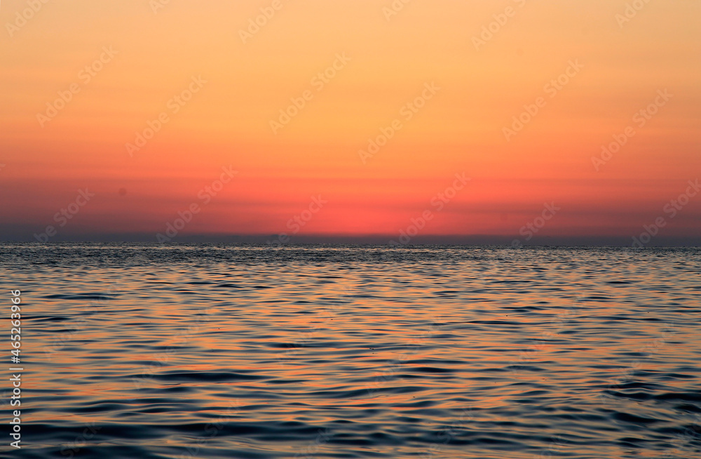 Subtropical sunset over sea. Tha Black sea seashore