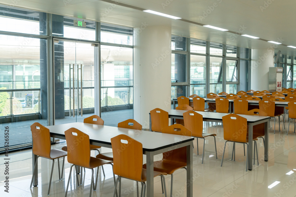 Tables and chairs in the dining hal Tables and chairs in the dining hal