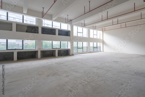 Undecorated interior space of office building photo