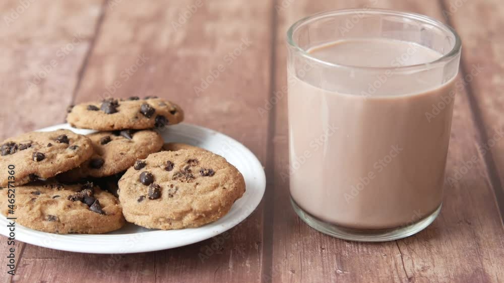 chocolate cooking and a glass of chocolate milkshake on table chocolate cooking and a glass of chocolate milkshake on table
