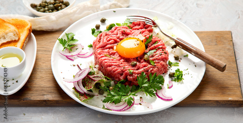 Wallpaper Mural Beef steak tartare on light background. French cuisine concept. Torontodigital.ca