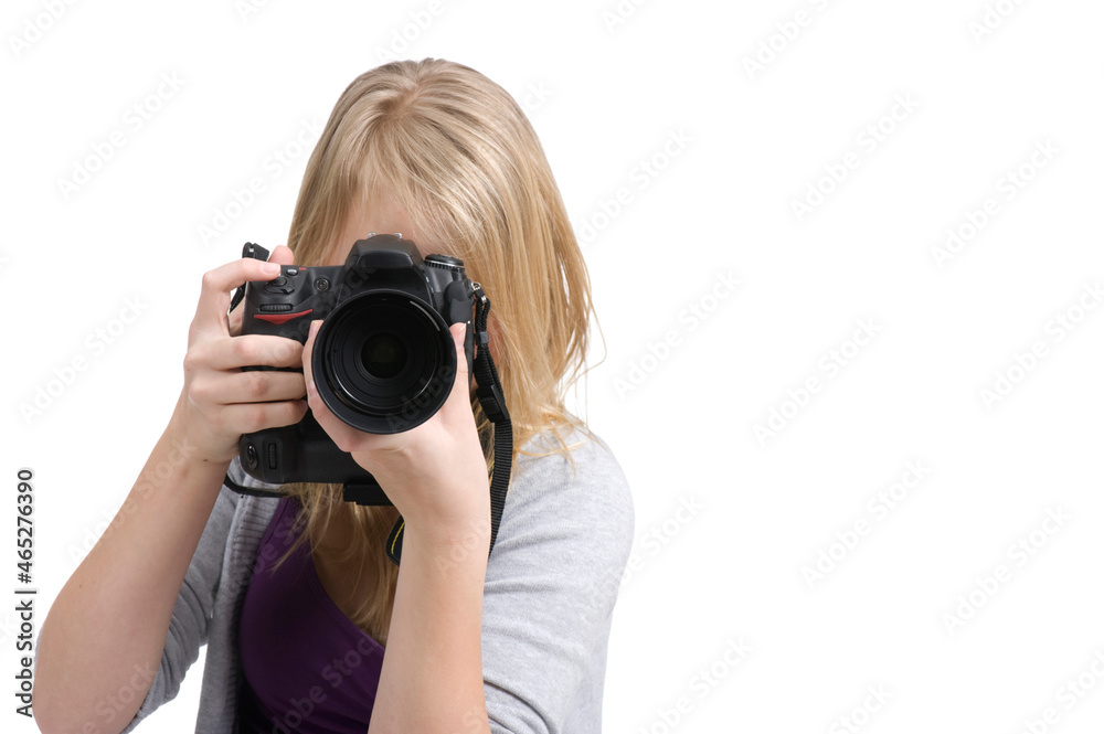 Young teenage girl holding a digital camera and taking a photo. Isolated on white. Young teenage girl holding a digital camera and taking a photo. Isolated on white.