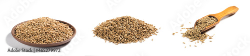 Set of spices cumin seeds (cuminum), jeera in wooden brown scoop, bunch, clay plate on white background isolated