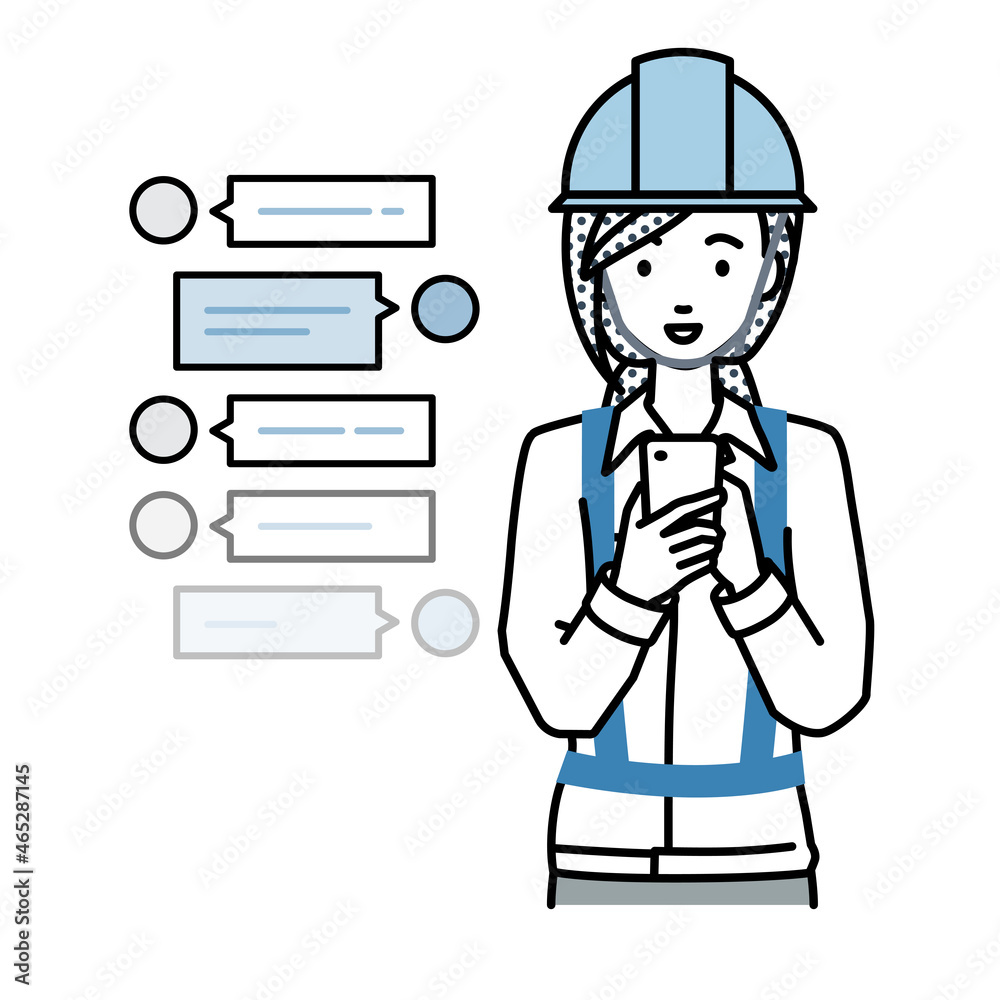 立ってスマートフォンで楽しくチャットで会話する工事現場の女性