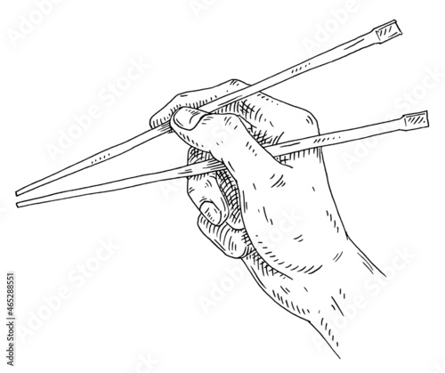 Male hand holding a chopsticks. Vintage hatching