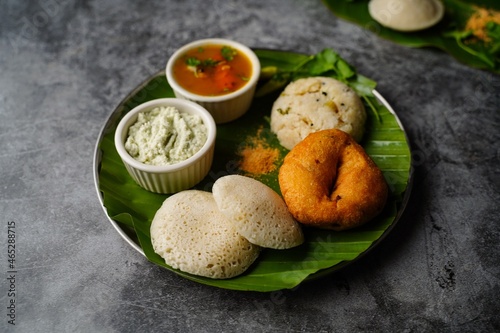 Vegetarian South Indian breakfast thali - Idli vada sambar chutney upma photo