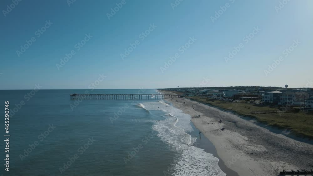 Rolling waves along Kure beach shoreline 4K AERIAL Rolling waves along Kure beach shoreline 4K AERIAL
