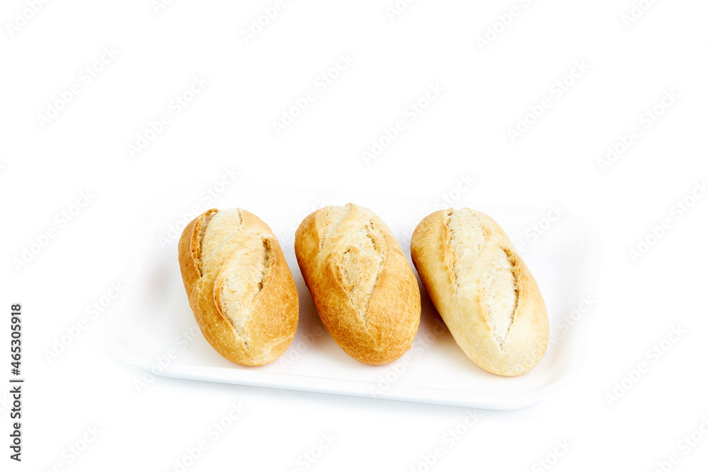 Three white buns isolated on a white tray and background Three white buns isolated on a white tray and background