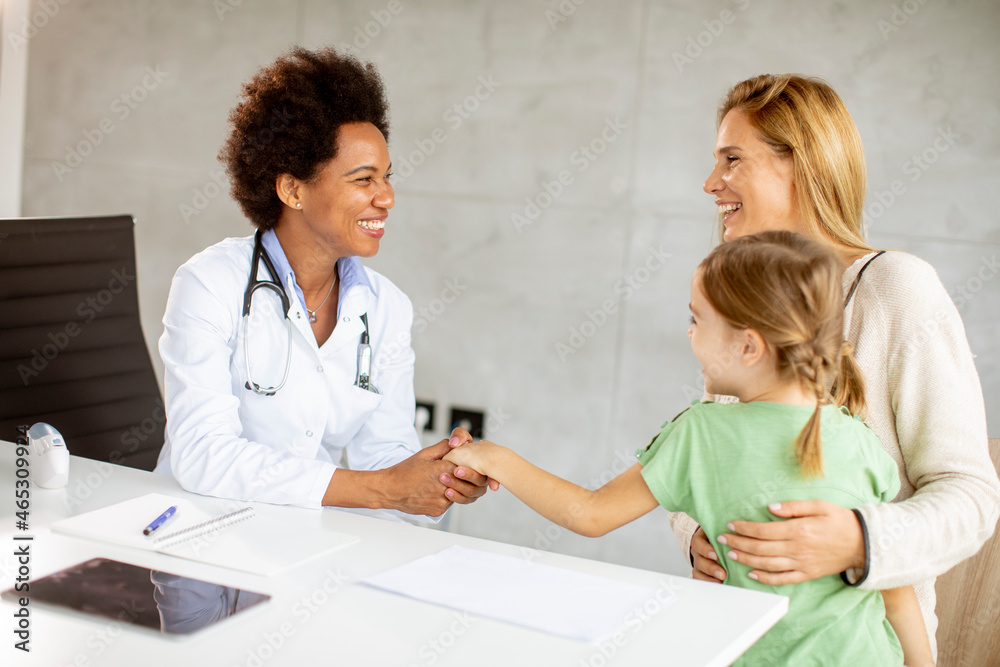 Cute little girl with her mother at the pediatrician examination Cute little girl with her mother at the pediatrician examination