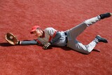Baseball Player Diving to Catch the Ball