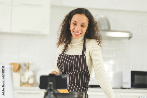 Blogger black women are beginning a home-based business to online teach cooking. Smartphone live streaming in social media. Work from home.