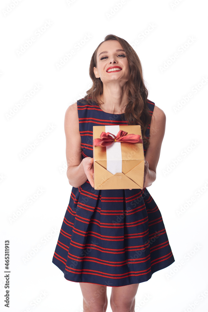Portrait of happy young Caucasian woman with red lips holding gift box with bow tie against white background Portrait of happy young Caucasian woman with red lips holding gift box with bow tie against white background