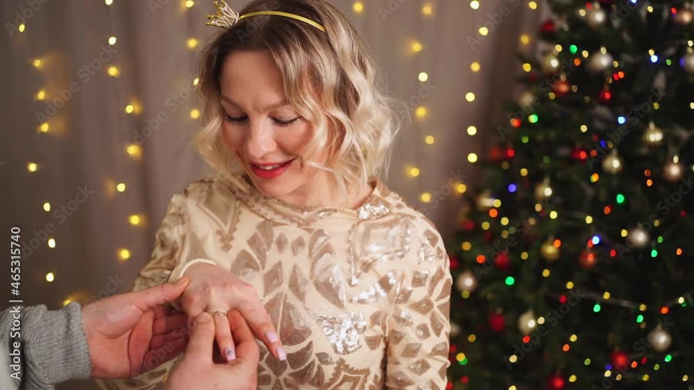 a man makes a marriage proposal at the Christmas tree. engagement. happy lovers. a man makes a marriage proposal at the Christmas tree. engagement. happy lovers.