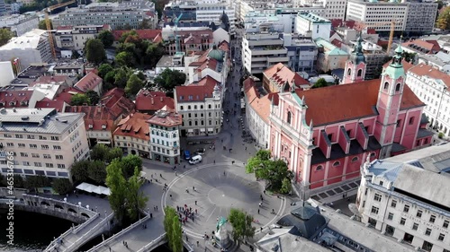 Drone shot from the Prešeren square. Drone view of the square in the historic center of Ljubljana. The Church of the Annunciation in Slovenia, view from a drone. Catholic Church in Ljubljana.  photo