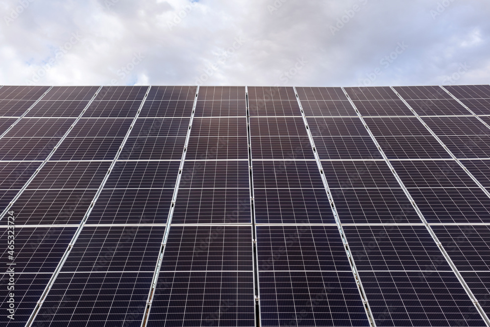 Solar panels on sky background