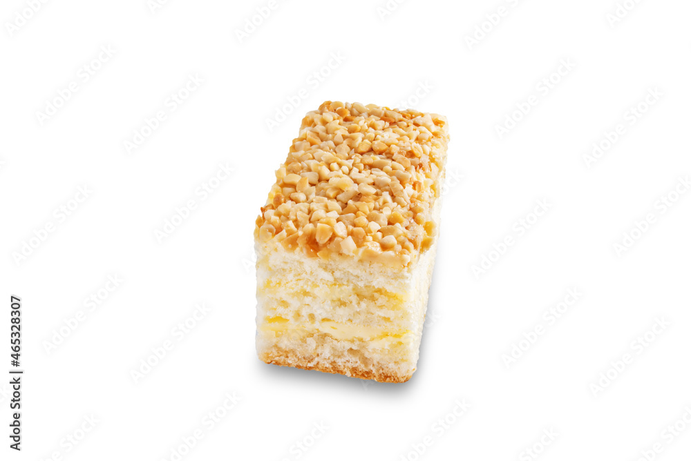 Sponge cake with cream and nuts on a white isolated background Sponge cake with cream and nuts on a white isolated background