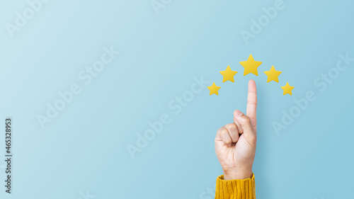 Customer giving a five star rating on pink background. Service rating, feedback, satisfaction concept photo