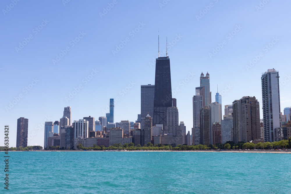 Fototapeta premium Chicago Skyline along Lake Michigan during the Summer with a Clear Blue Sky