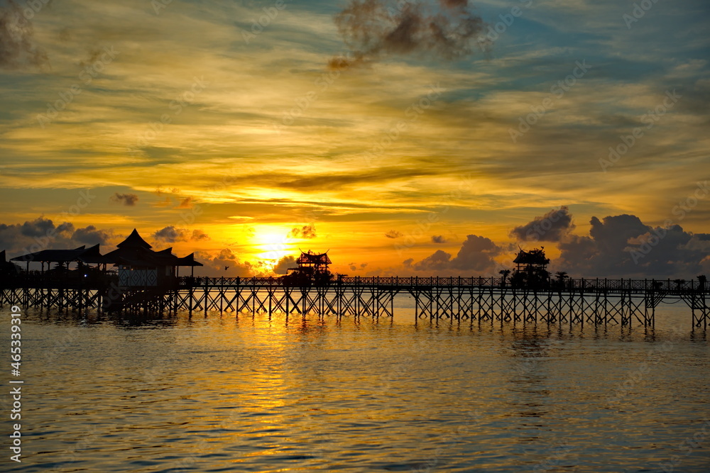 Malaysia. The east coast of Borneo. A blazing dawn on the reef island of Mabul, famous all over the world for its diving clubs.