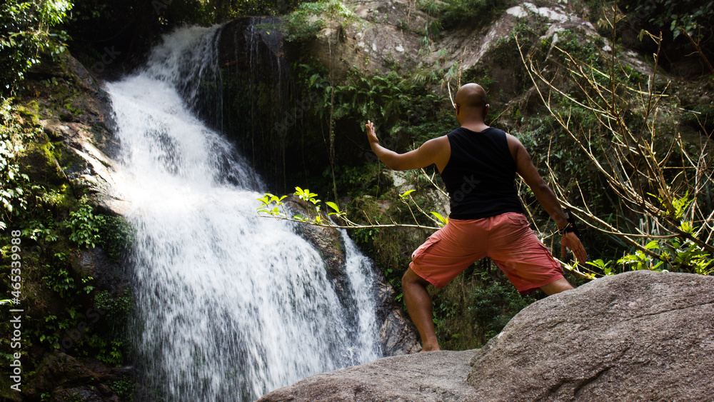 person near waterfall, thailand person near waterfall, thailand
