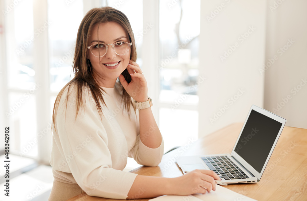 Businesswoman working on laptop at home Businesswoman working on laptop at home