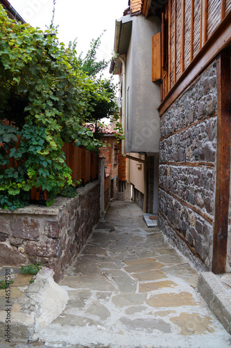 Fototapeta Naklejka Na Ścianę i Meble -  narrow cobbled street of the old town of Sozopol Bulgaria