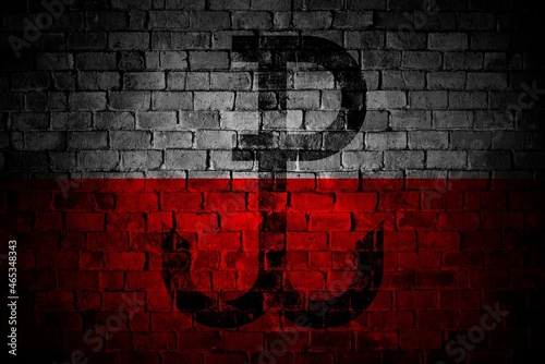 Sign of Warsaw Rising  on brick wall in grunge style with colors of polish flag. Poland country industrial city graphic. World War Two.